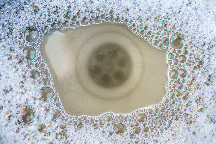 Clogged kitchen sink requiring drain cleaning
